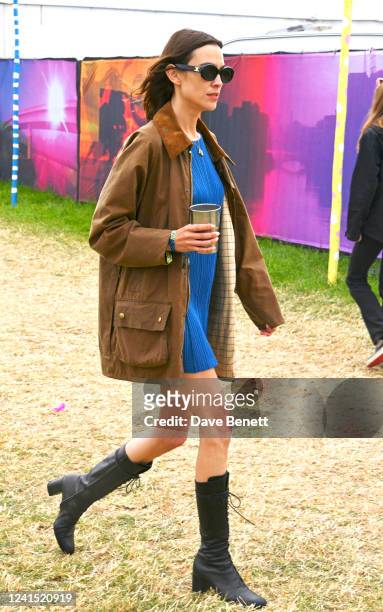 Alexa Chung is seen on day one of the festival wearing her vintage Barbour jacket on June 24, 2022 in Glastonbury, England.