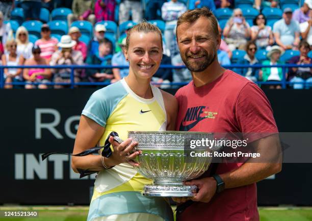 Petra Kvitova of the Czech Republic and boyfriend and coach Jiri Vanek pose with the champion's trophy after defeating Jelena Ostapenko of Latvia in...