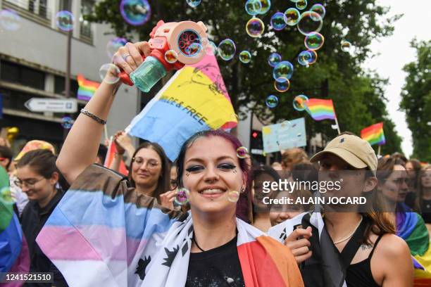 Participant uses a bubble gun during the annual Pride Parade in Paris on June 25, 2022. The Inter-LGBT association who is organising the march say...