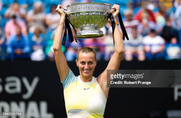Petra Kvitova of the Czech Republic poses with the champion's trophy after defeating Jelena Ostapenko of Latvia in the women's singles final on Day 8...