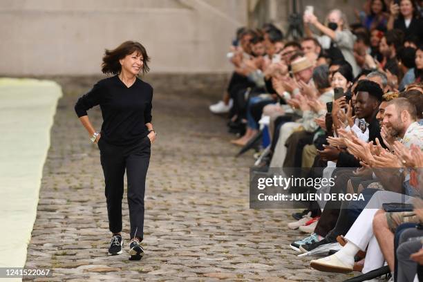 French designer Veronique Nichanian acknowledges the audience at the end of the Hermes Menswear Spring Summer 2023 show as part of Paris Fashion...