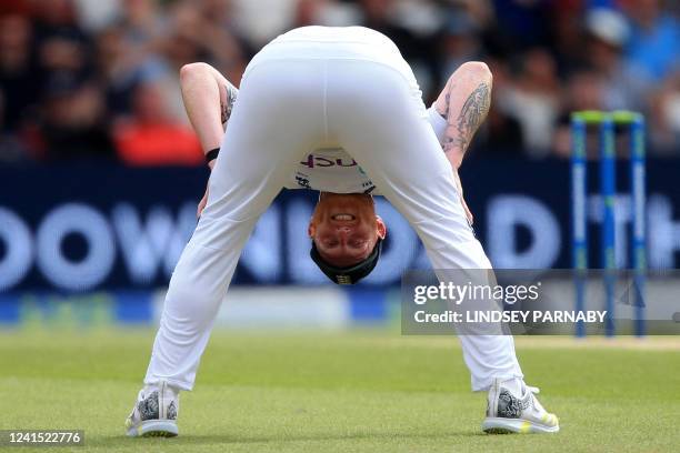 England's captain Ben Stokes reacts in the field after New Zealand's captain Kane Williamson narrowly avoids being dismissed during play on day 3 of...