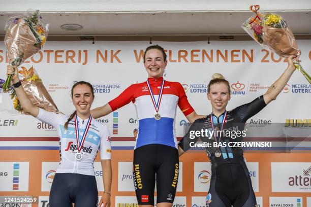 Second-placed Shirin van Anrooij, winner Riejanne Markus and third-placed Lorena Wiebes pose on the podium after the National Cycling Championships...