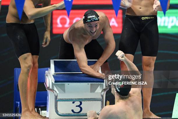 Italy's Federico Burdisso celebrates with Italy's Alessandro Miressi after they won the men's 4x100m medley relay finals during the Budapest 2022...