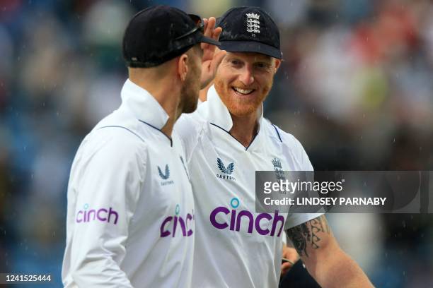 England's captain Ben Stokes and England's Jack Leach smile as they leave as rain stops play on day 3 of the third cricket Test match between England...