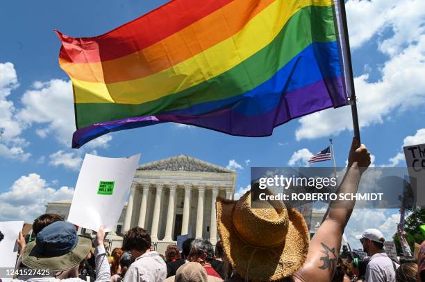 An abortion rights demonstrator waves a Pride flag during a rally in front of the US Supreme Court in Washington, DC, on June 25 a day after the...