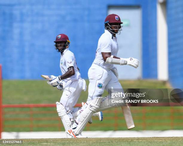 Jermaine Blackwood and Kyle Mayers , of West Indies, celebrate their 100 runs partnership during the second day of the 2nd Test between Bangladesh...