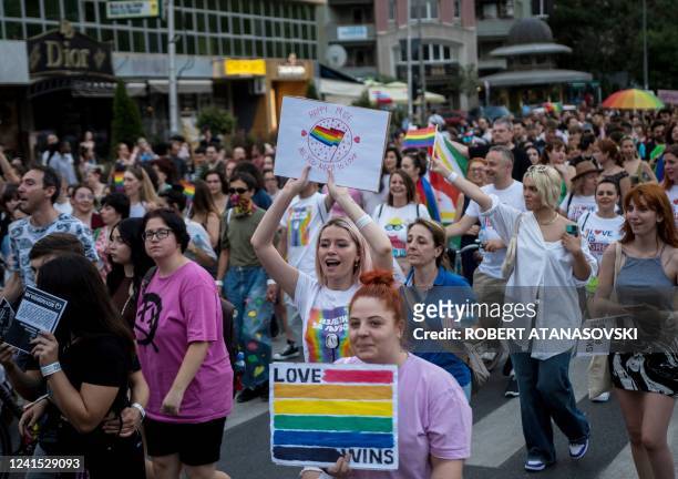 Participants take part in the Skopje Pride parade in downtown Skopje on June 25, 2022. - North Macedonia is holding its second Pride Parade in...