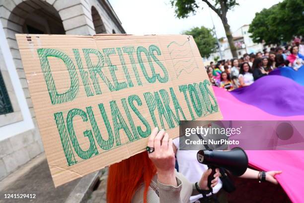 People attend the Marcha Do Orgulho LGBTI+ 2022 in Porto, Portugal on June 25, 2022.