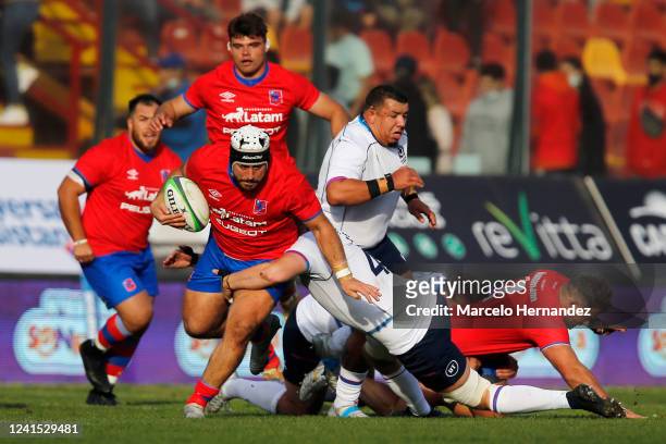 Vittorio Lastra of Chile is tackled by Jamie Hodgson of Scotland during a test match at Santa Laura Stadium on June 25, 2022 in Santiago, Chile.