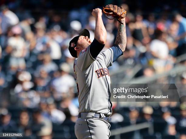 Ryan Pressly of the Houston Astros reacts after the final out of a combined no hitter against the New York Yankees at Yankee Stadium on June 25, 2022...