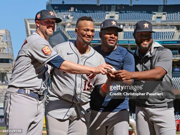Ryan Pressly, Martin Maldonado, Hector Neris of the Houston Astros and Cristian Javier of the Houston Astros pose for a photo after pitching a...