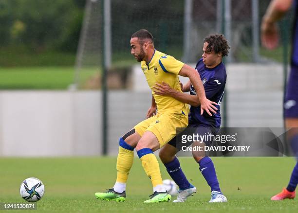 S Fatih Kaya and Anderlecht's Loic Masscho fight for the ball during a friendly match between Belgian first division soccer teams RSCA Anderlecht and...