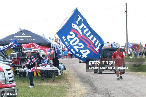 Supporters of former US President Donald Trump await to enter the Save America Rally at the Adams County Fairgrounds on June 25, 2022 in Mendon,...