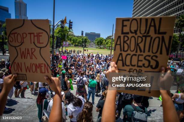 People protest in front of the Los Angeles City Hall in downtown Los Angeles, on June 25 a day after the Supreme Court released a decision on Dobbs v...