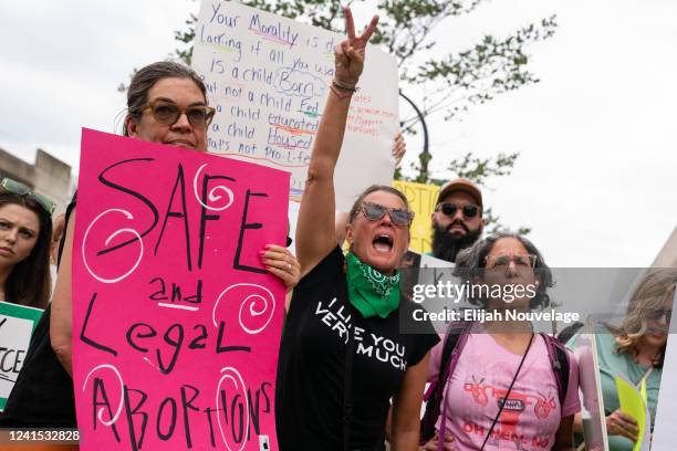 Woman yells during a protest against the Supreme Court's ruling in the Dobbs v Jackson Women's Health Organization on June 25, 2022 in Atlanta,...