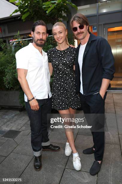 Clemens Schick, Lilly Krug and Friedrich Muecke during the RTL Fiction party as part of the Filmfest München at Lucky Who bar on June 25, 2022 in...