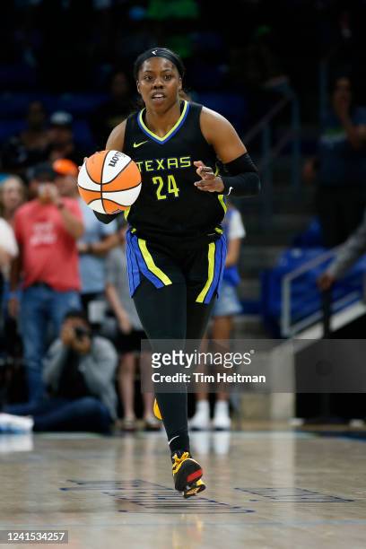 Arike Ogunbowale of the Dallas Wings dribbles the ball during the game against the Phoenix Mercury on June 25, 2022 at the College Park Center in...