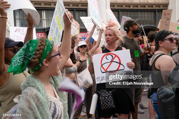 People march in the street during a protest against the Supreme Court's ruling in the Dobbs v Jackson Women's Health Organization on June 25, 2022 in...