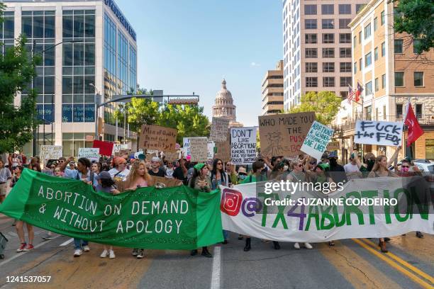 Abortion rights demonstrators march near the State Capitol in Austin, Texas, June 25, 2022. Abortion rights defenders fanned out across America on...
