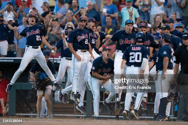 Calvin Harris of the Ole Miss Rebels celebrates a home run with his teammates during Game One of the Men's College World Series against the Oklahoma...