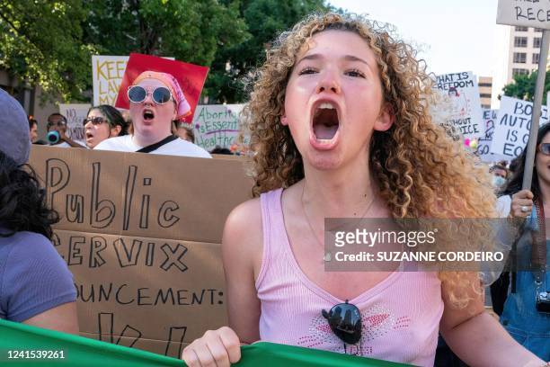 An abortion rights demonstrator chants slogans as they march near the State Capitol in Austin, Texas, June 25, 2022. - Abortion rights defenders...