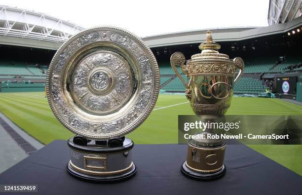 The Venus Rosewater Dish, the Ladies' Singles trophy and the Gentlemans Singles trophy ahead of The Championships Wimbledon 2022 at All England Lawn...