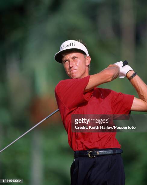 Robert Allenby of Australia plays off the tee during the Johnnie Walker Classic at the Singapore Island Country Club in Singapore, circa February...