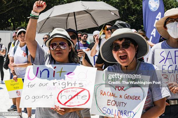 Demonstrators attend the Unity March on the National Mall on June 25 organized by a coalition of Asian American groups to promote multicultural...