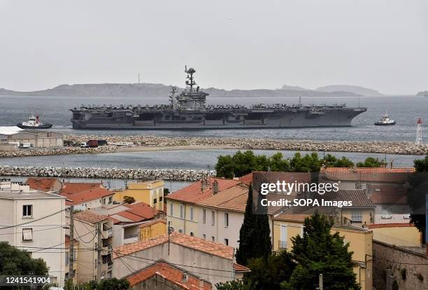 The aircraft carrier USS Harry S. Truman leaves in the French Mediterranean port of Marseille.