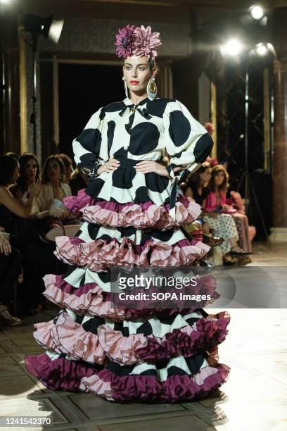 Model showcases a design of the brand Flor de Cerezo, the catwalk of the International Flamenco Fashion Show at the Wellington Hotel in Madrid.