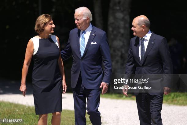 President Joe Biden German Chancellor Olaf Scholz and wife Britta Ernst walk to the first working session on the first day of the three-day G7 summit...