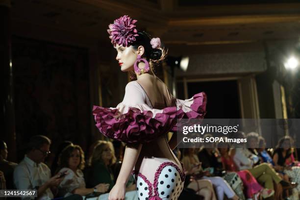 Model showcases a design of the brand Flor de Cerezo, the catwalk of the International Flamenco Fashion Show at the Wellington Hotel in Madrid.