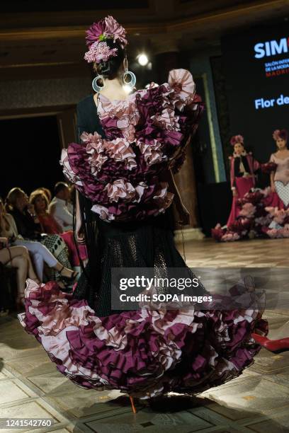 Model showcases a design of the brand Flor de Cerezo, the catwalk of the International Flamenco Fashion Show at the Wellington Hotel in Madrid.