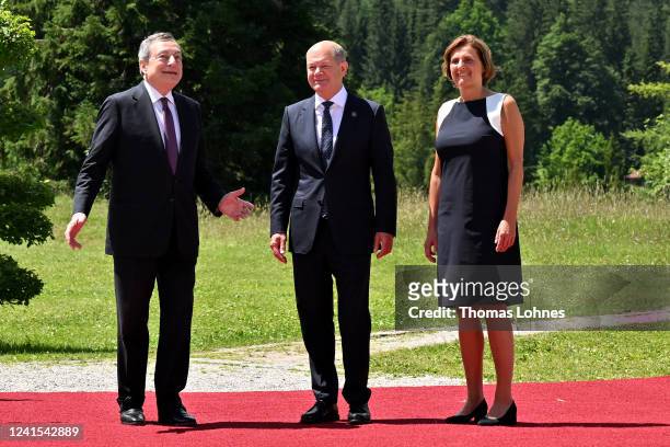 German Chancellor Olaf Scholz and his wife Britta Ernst greet Italian Prime Minister Mario Draghi during a welcome ceremony on the first day of the...