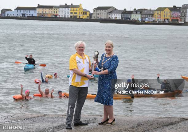 Batonbearer Mayor Councillor Karen Douglas, Ards and Down Borough Council, holds the Queens Baton alongside Robert McVeigh, Northern Ireland...