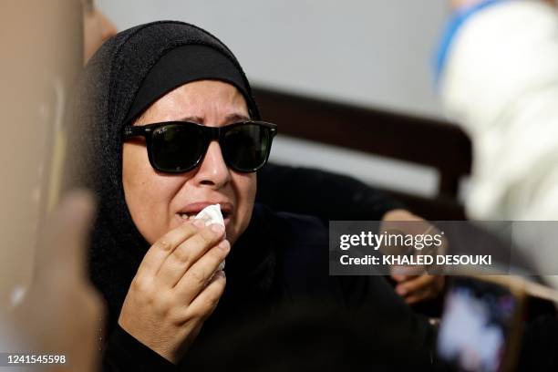 The mother of murdered university of Mansoura student Naira Ashraf, reacts as she attends the first trial session of the presumed murderer Mohamed...