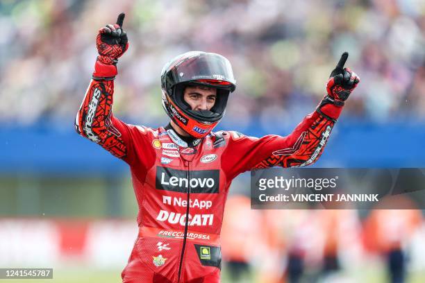 Ducati's Italian rider Francesco Bagnaia celebrates after victory in the Dutch MotoGP at the TT circuit of Assen on June 26, 2022. - Italy's...