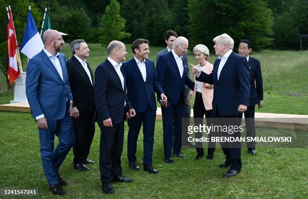 Britain's Prime Minister Boris Johnson speaks with European Council President Charles Michel, Italy's Prime Minister Mario Draghi, Germany's...