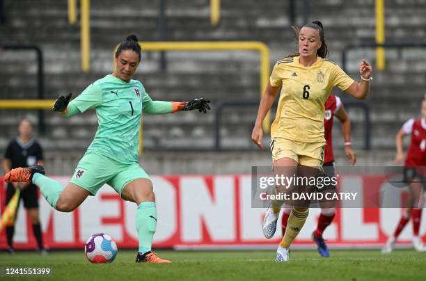 Austria's goalkeeper Manuela Zinsberger and Belgium's Tine De Caigny fight for the ball during the friendly match between Belgium's national women's...