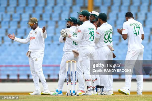 Shakib Al Hasan , of Bangladesh, and teammates celebrate the dismissal of Anderson Phillip, of West Indies, during the third day of the 2nd Test...