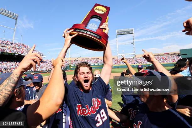 Jack Dougherty of the Ole Miss Rebels hoists the national championship trophy after the game against the Oklahoma Sooners during the Division I Men's...