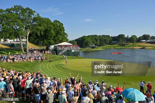 Sahith Theegala fist pumps while making a putt on the 17th green during the final round of the Travelers Championship at TPC River Highlands on June...