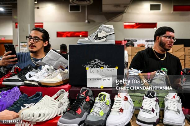 Pair of limited edition Jordan 1 Retro High Dior shoes is displayed during the Got Sole Sneaker Convention in Miami, Florida on June 26, 2022.