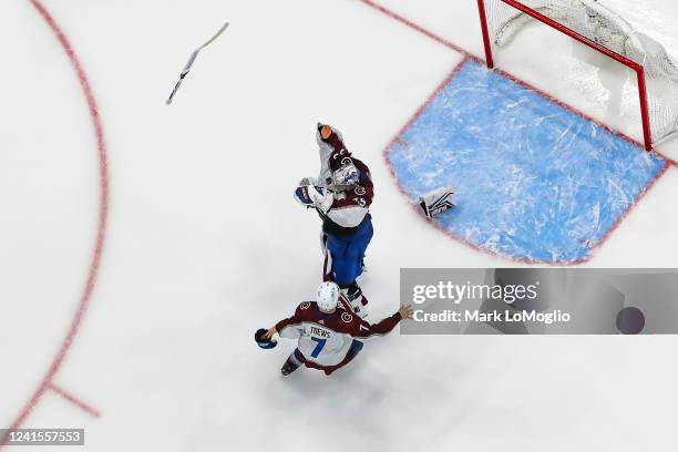 Goalie Darcy Kuemper and Devon Toews of the Colorado Avalanche celebrate winning the Stanley Cup after Game Six of the 2022 Stanley Cup Final against...