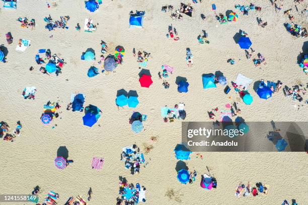 An aerial view is seen as people enjoy warm weather at the Long Branch beach in southern New Jersey, United States on June 26, 2022.