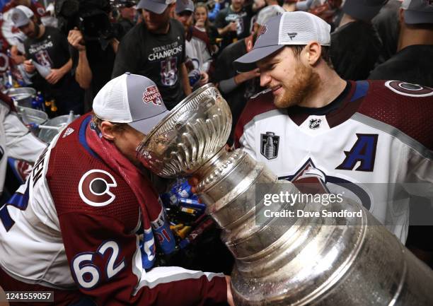 Artturi Lehkonen of the Colorado Avalanche drinks out of the Stanley Cup in the locker room after Game Six of the 2022 Stanley Cup Final at Amalie...