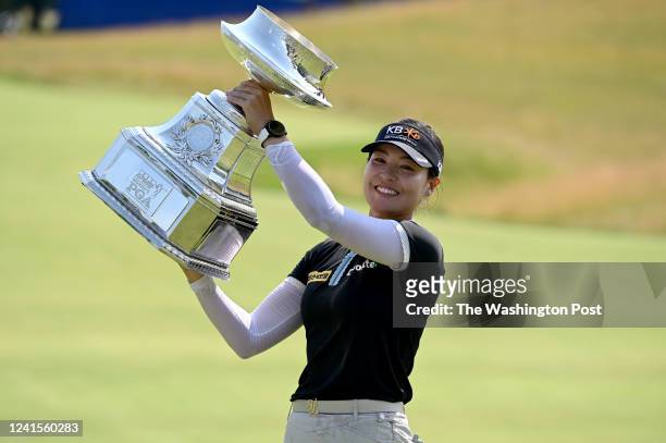 In Gee Chun hoists the trophy after winning the KPMG Womens PGA Championship at Congressional Country Club with a 5-under-par June 26, 2022 in...
