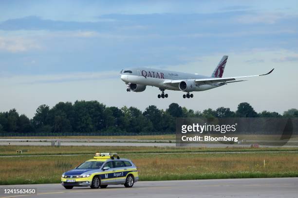 Passenger aircraft, operated by Qatar Airways QCSC, lands at Munich International Airport in Munich, Germany, on Sunday, June 26, 2022. Although...