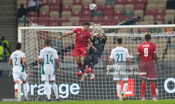 Douala, Cameroon, January 2022: Saúl Coco of Equatorial Guinea and Raïs M'Bolhi of Algeria during Algeria against Equatorial Guinea, Africa Cup of...